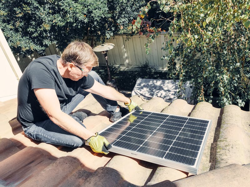 Solar panel being installed on a roof